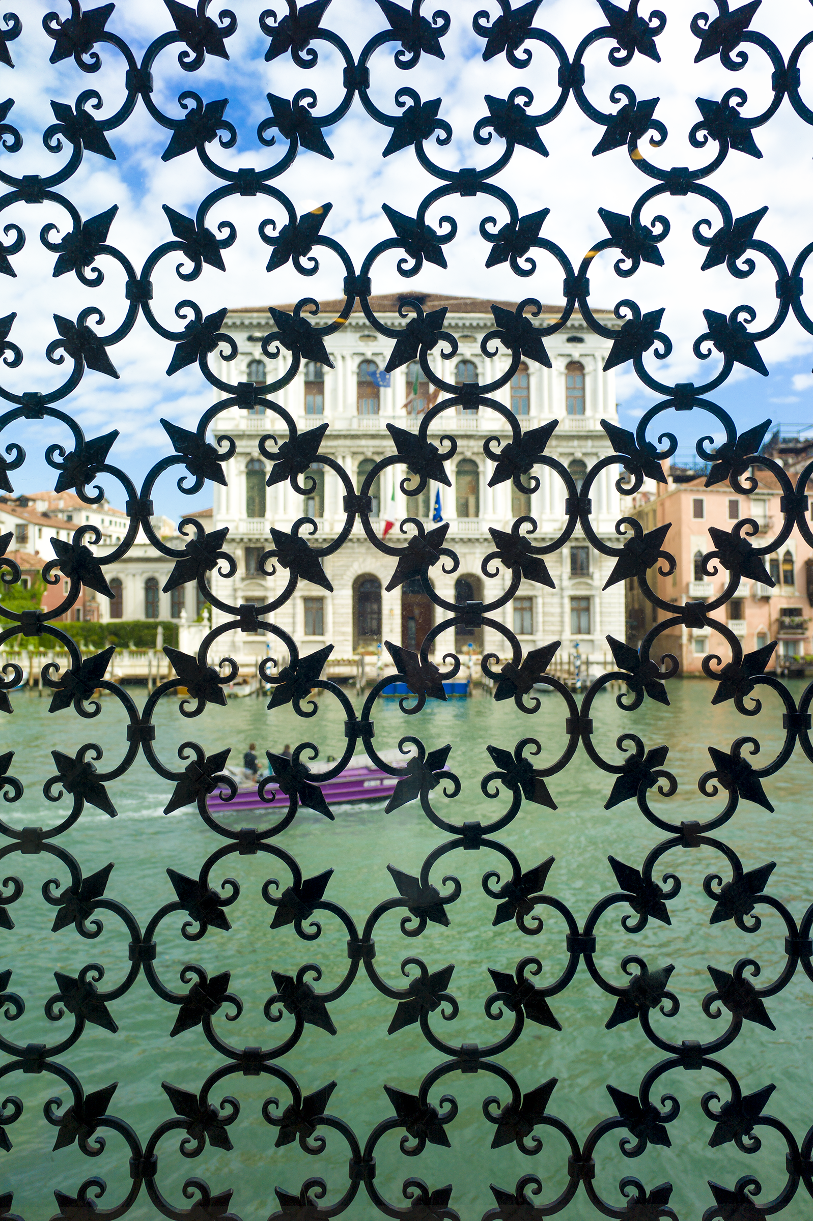 view of Venice canal through decorative grate
