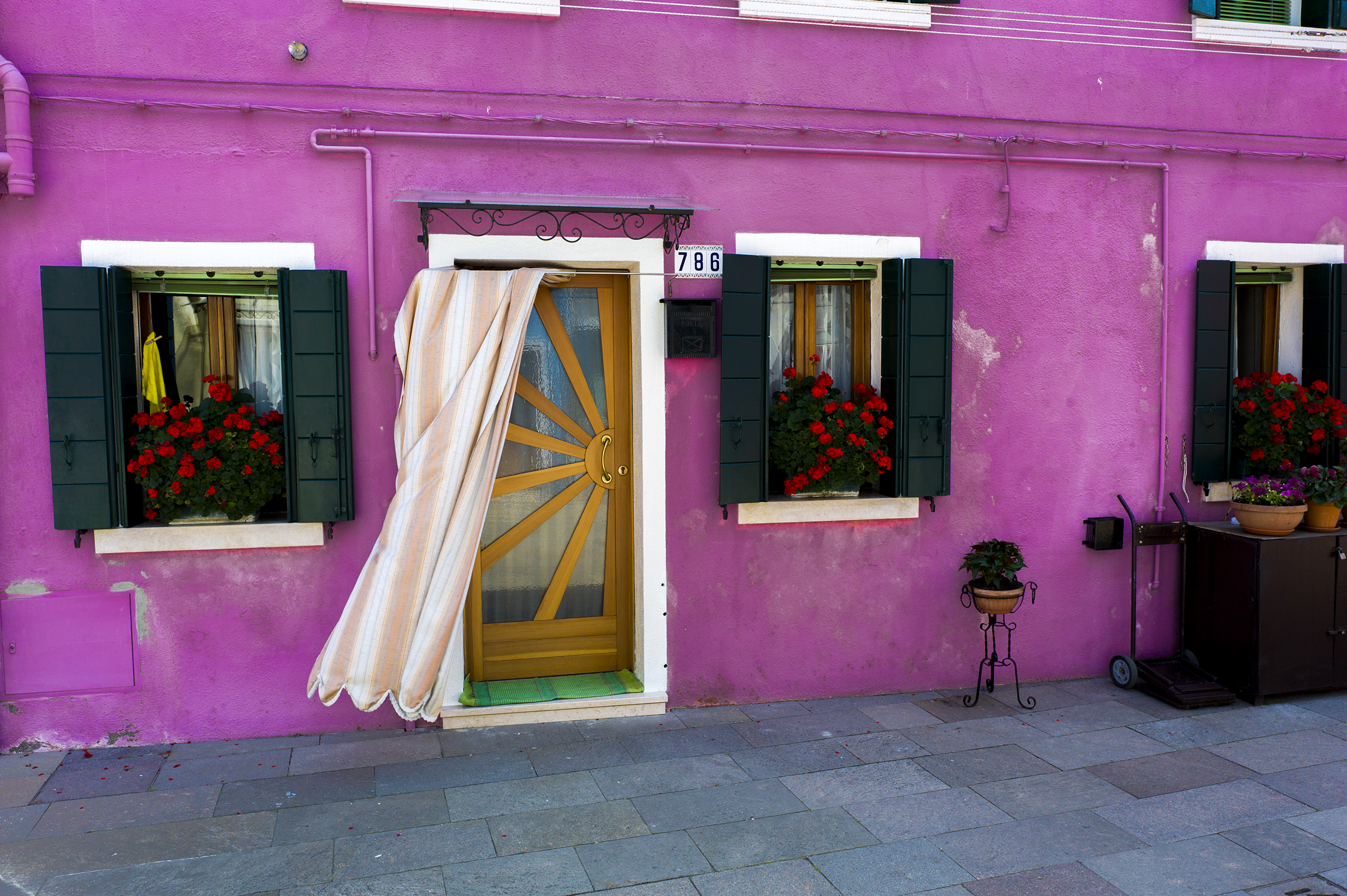 Colorful building with flowers in window boxes