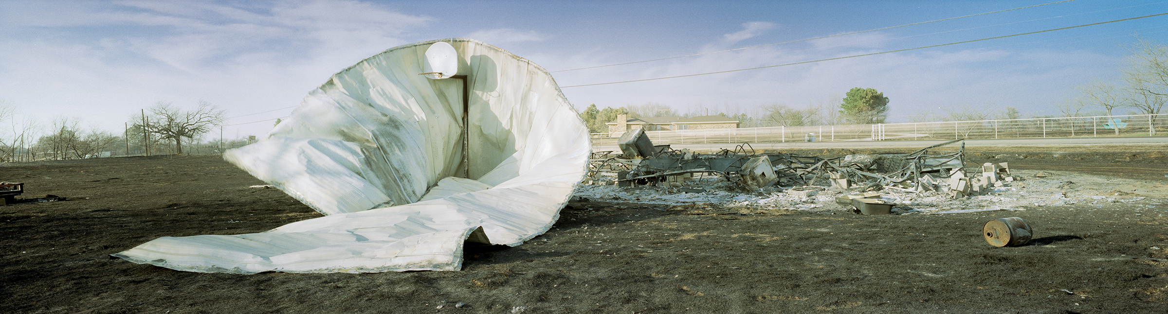 burnt trailor wrapped around basketball goal